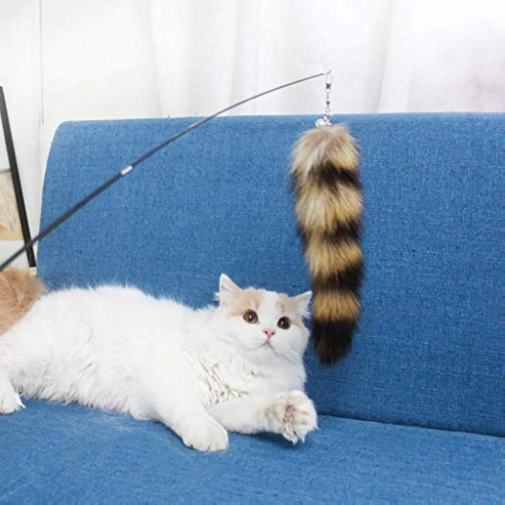 Black cat toy wand teaser with long elastic string stretched out for play.