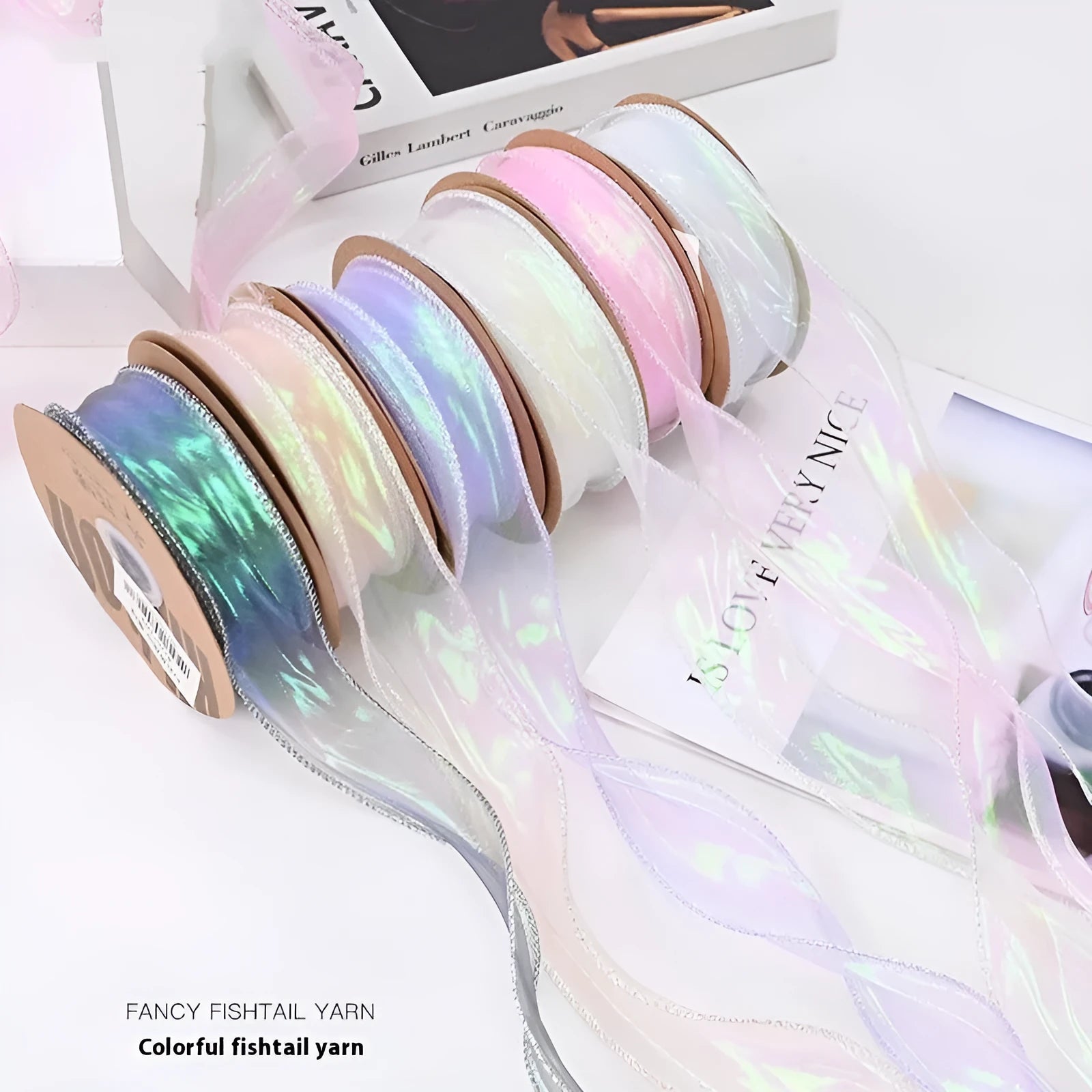 Roll of colourful fishtail yarn mesh ribbon with wave pattern, showing 4cm width.