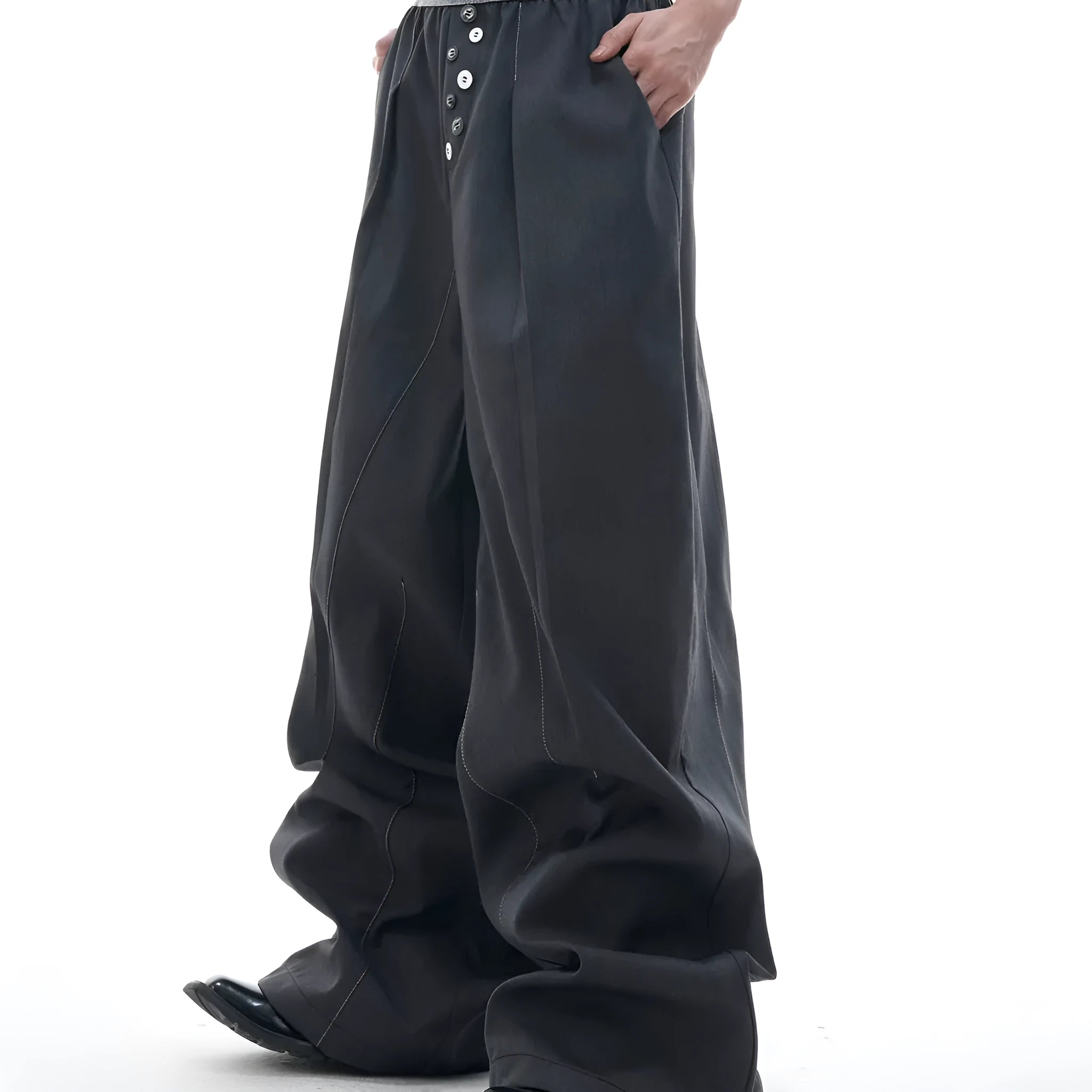 Man's black high-waisted straight-leg casual trousers with a button fly.