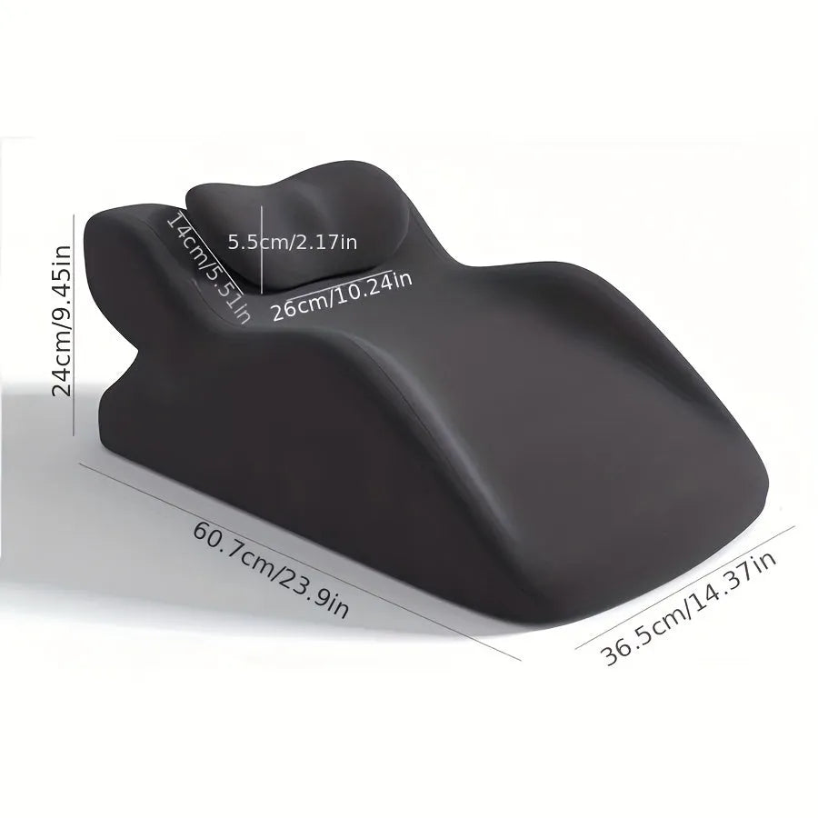 A stomach sleeper's pillow in a choice of blue, dark grey, green, or light grey, shown supporting a person lying on their front.