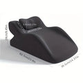 A stomach sleeper's pillow in a choice of blue, dark grey, green, or light grey, shown supporting a person lying on their front.