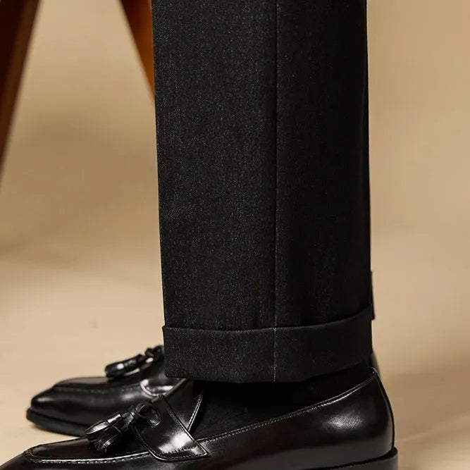 Men's black and brown polished leather tassel loafers with rubber sole