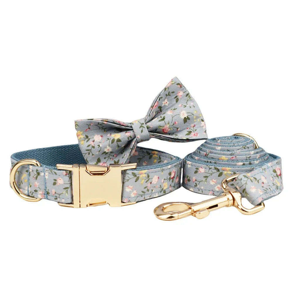 Floral dog collar set with matching leash, vest, and bow accessories in polyester cotton cloth