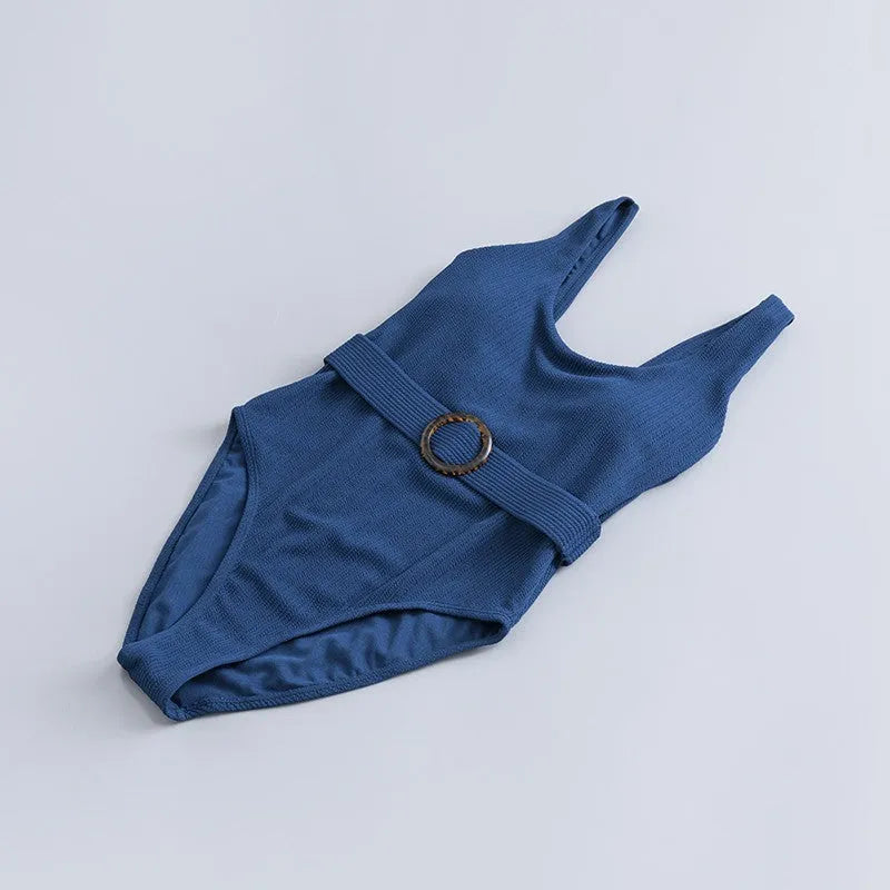 Navy blue women's one-piece slimming triangle swimsuit with chest pads on mannequin