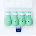 Four green silicone cat scratch prevention foot covers with an adjustable strap laid flat