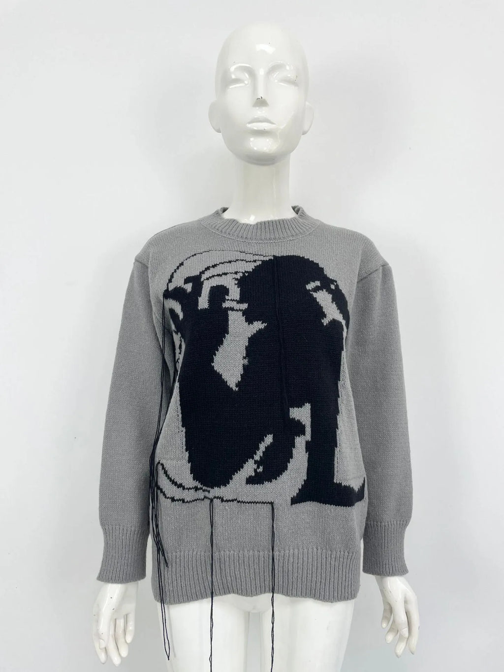 Women's grey alpaca wool pullover sweater with tassel detailing and abstract pattern