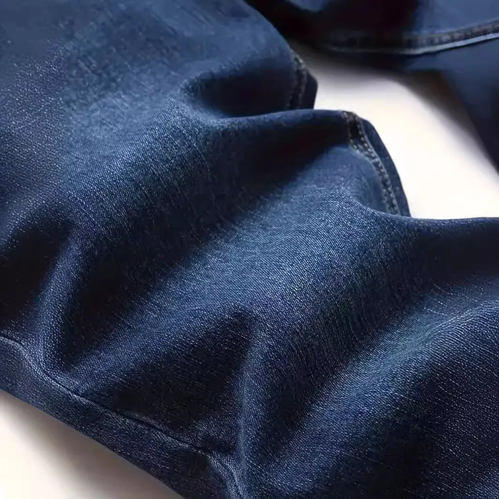 Men's dark blue slim fit casual jeans with skinny leg cut and zipper fly closure