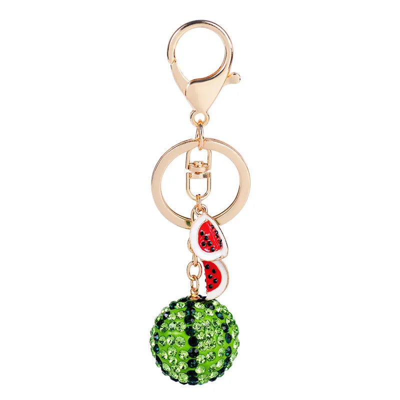 Green watermelon-shaped zinc alloy keychain measuring 12 centimetres