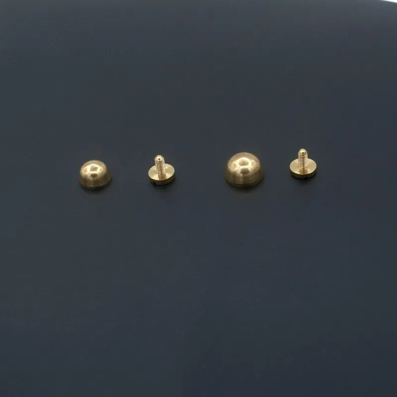 Brass decorative foot nail buckle in round and geometric designs, sizes 10x6mm and 12x7mm.