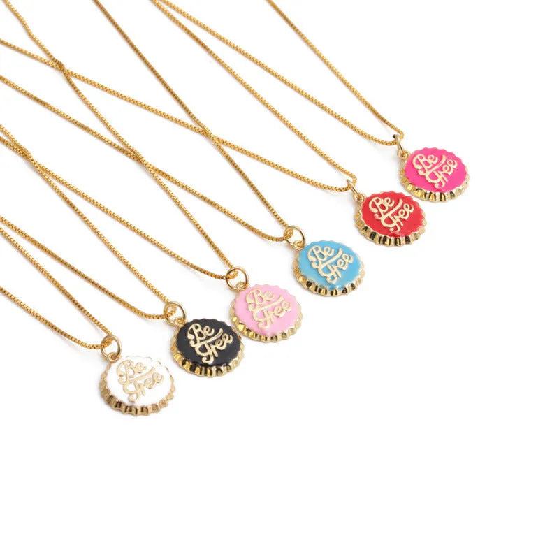Gold-plated copper Be Free bottle cap pendant necklace on a 40cm box chain.