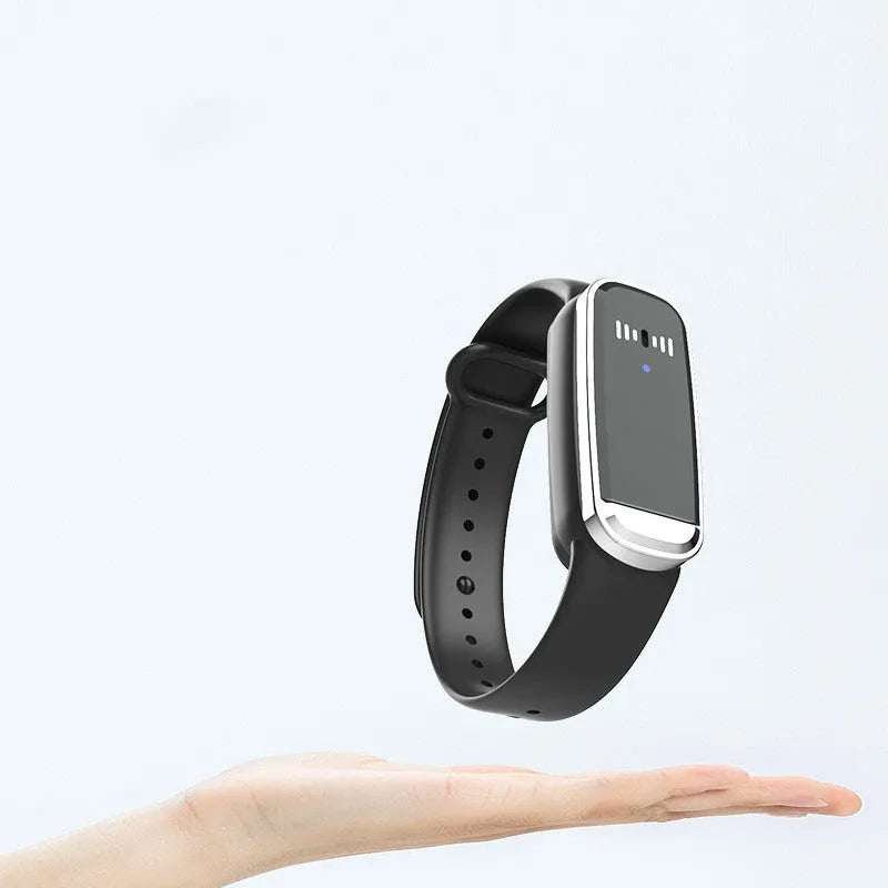 Black and white ultrasonic mosquito repellent bracelet with USB charging cable showing wearable design