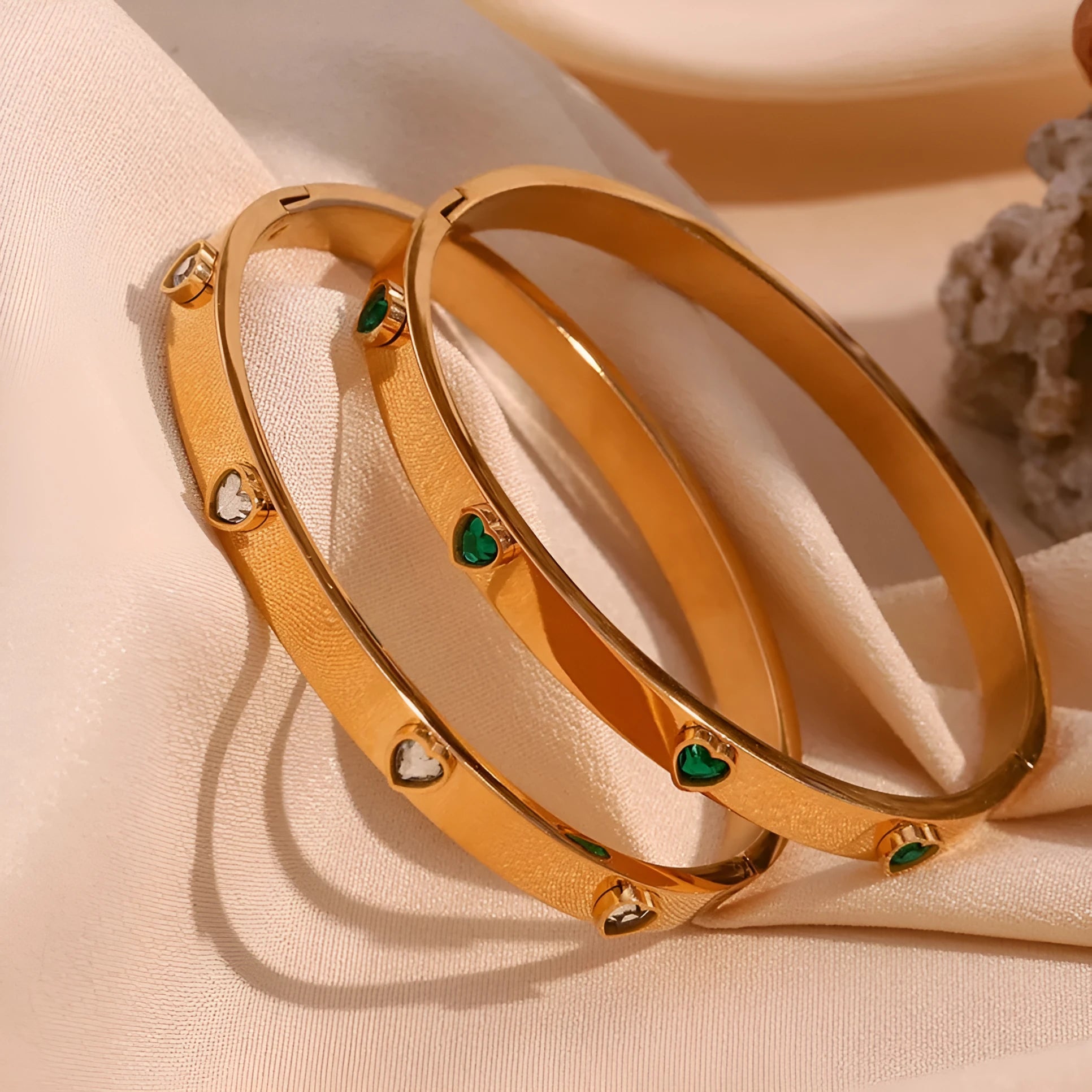 Stainless steel peach heart bracelet for women in a golden electroplated finish.