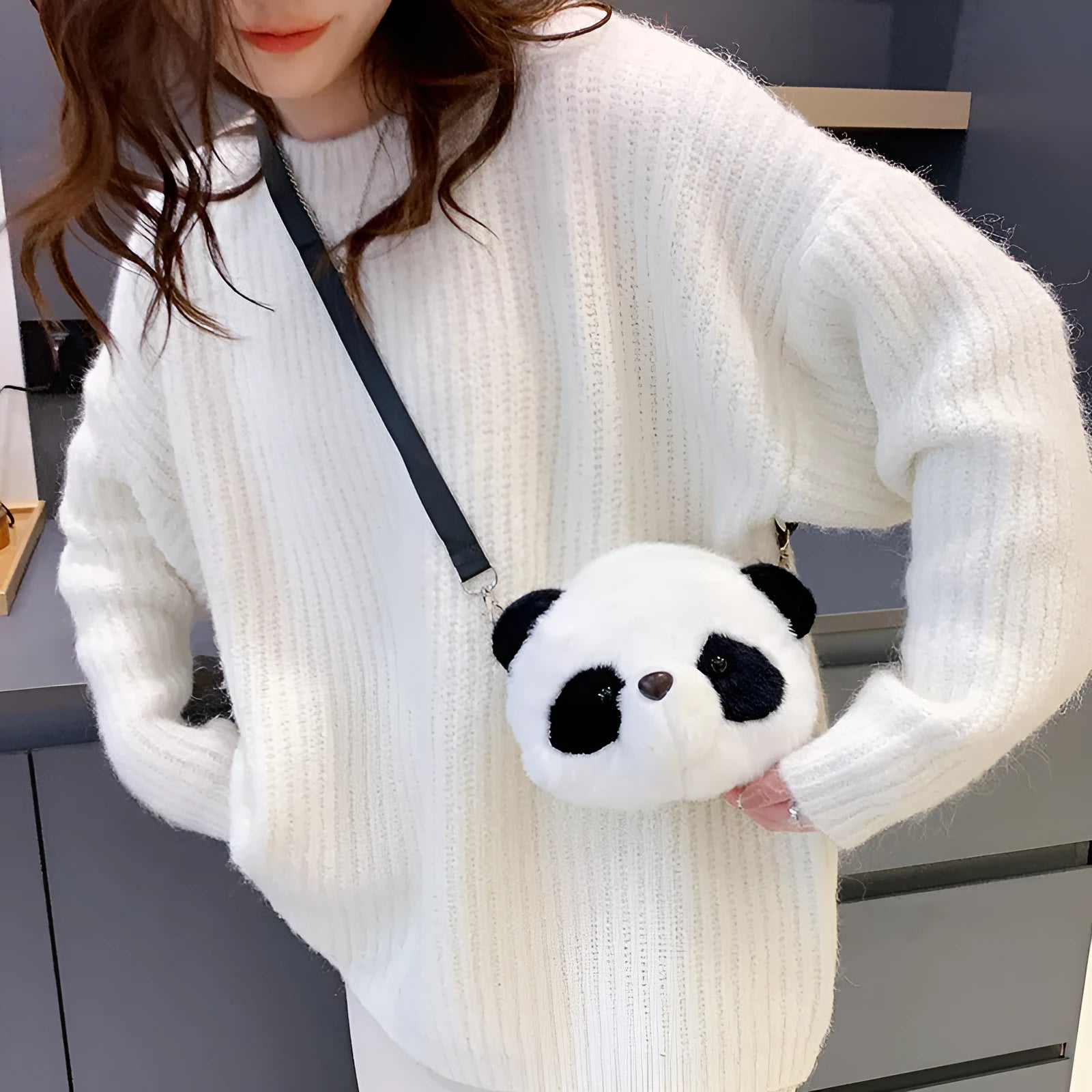 Soft plush cylindrical crossbody bag with panda head print, showing sandwich pocket