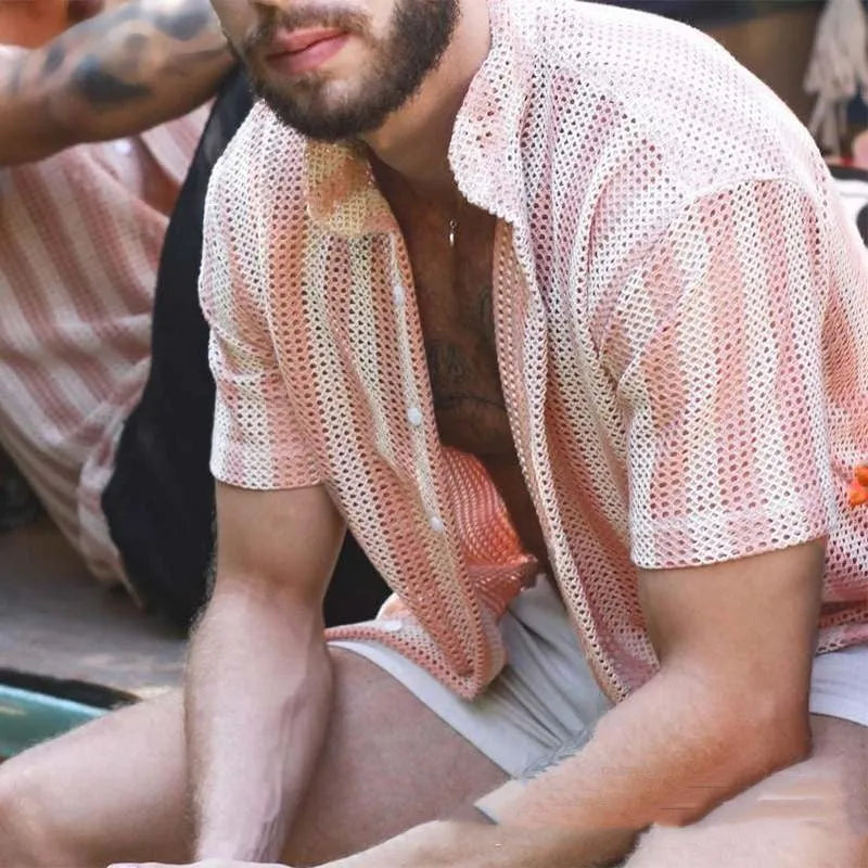Pink men's loose-fit cardigan shirt with short sleeves and a waffle-textured fabric.