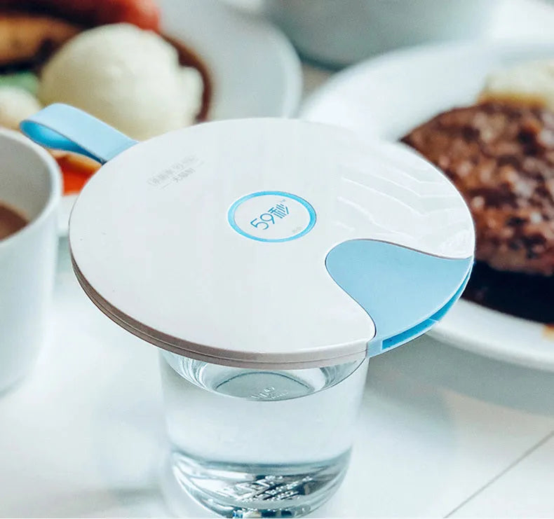 A slim, portable baby bottle sterilizer in blue or pink, showing USB port and compact design.