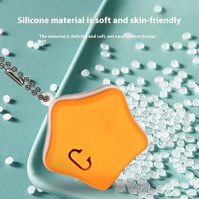 Blue and orange silicone rechargeable pendant light for pet collars, showing LED on.