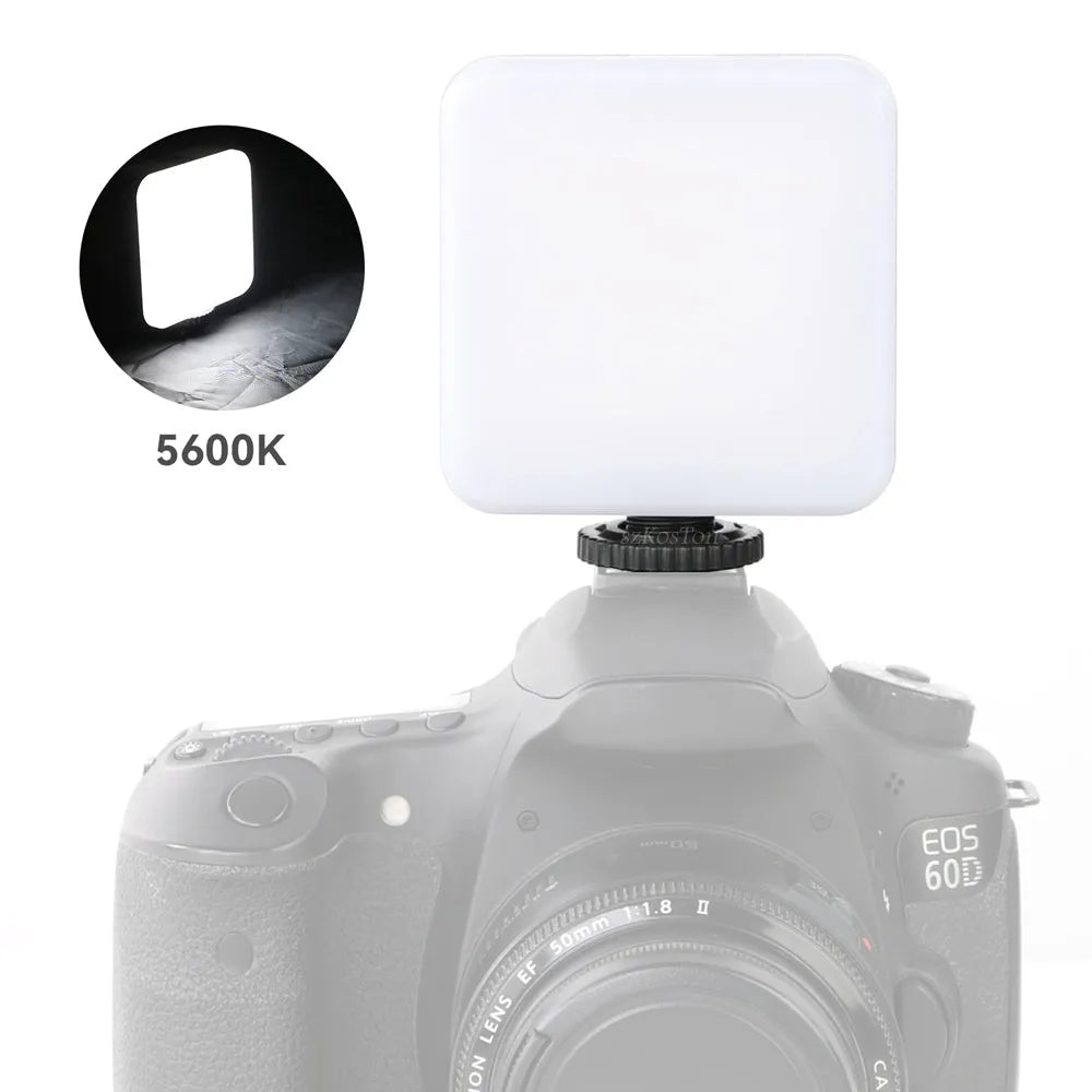Compact square LED outdoor flash unit with mini tripod, showing rotatable head and scale indicating 7.3cm size.