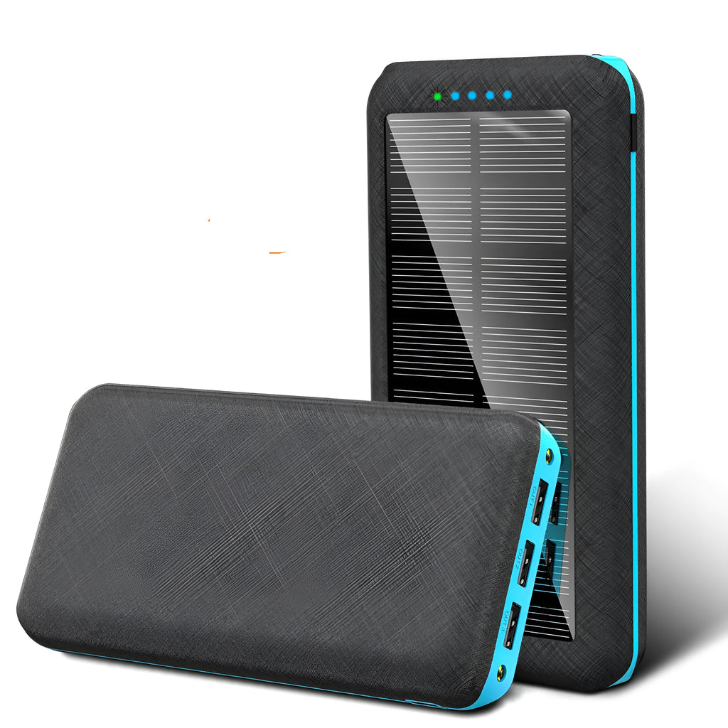 Black portable power bank with wireless charging surface and three USB ports for multiple device charging