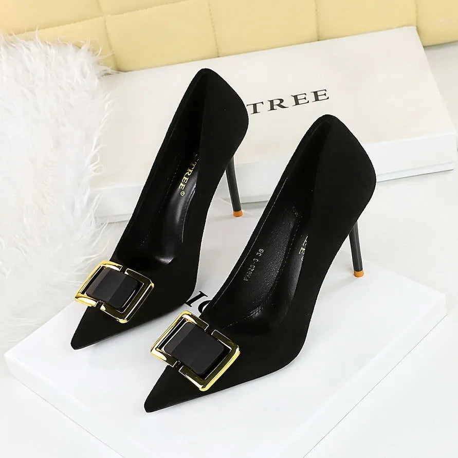 Black suede women's court shoes with a 9cm stiletto heel and pointed toe on a white background