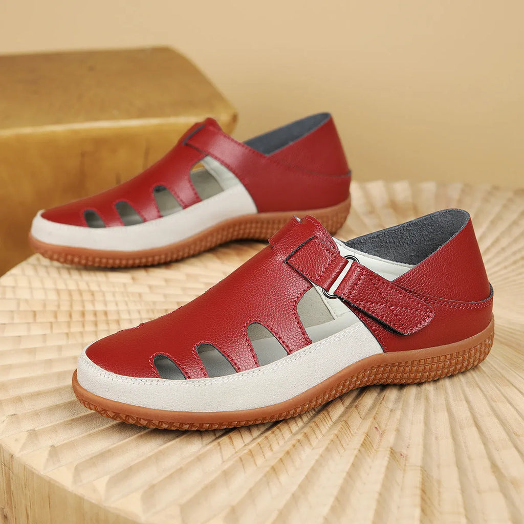 Women's flat sandals with hollow-out toe cap design in blue colour showing thick rubber sole