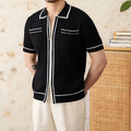 Men's slim fit black lapel polo shirt with short sleeves on a hanger
