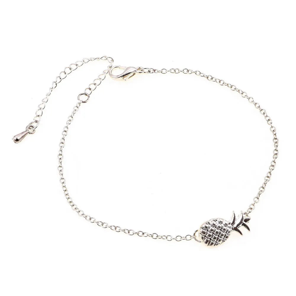 Women's alloy bracelet with a detailed pineapple charm in gold or silver tone.