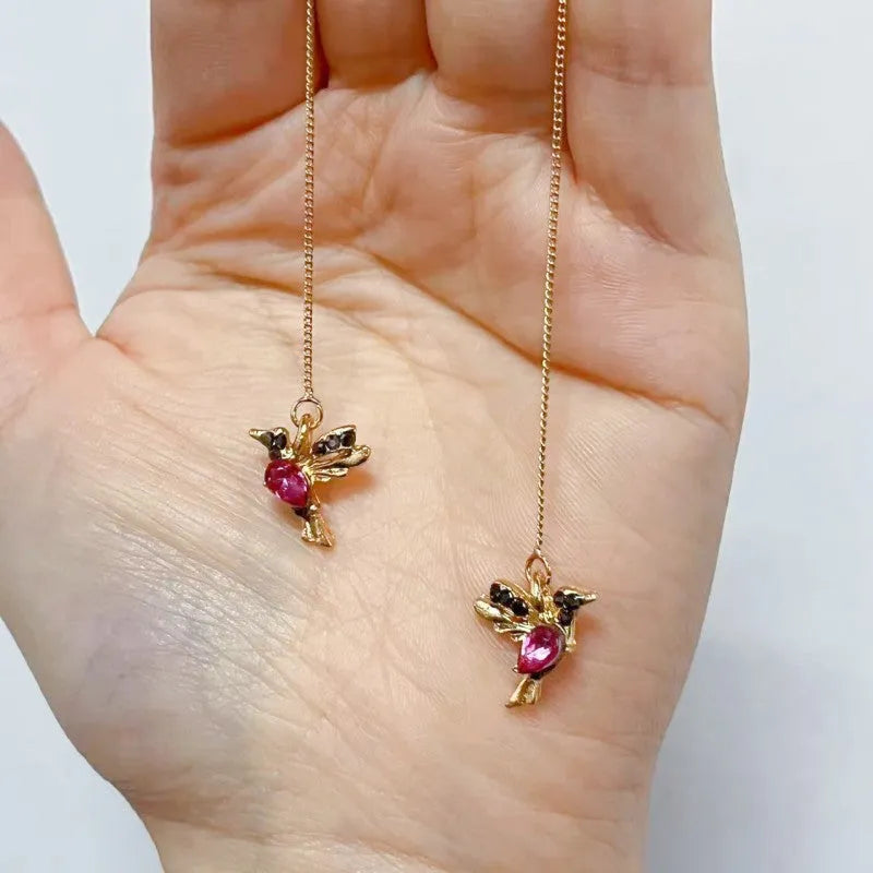 Long bird hanging earrings with mixed zirconium wings in blue, red, and red lvzuan colour options.