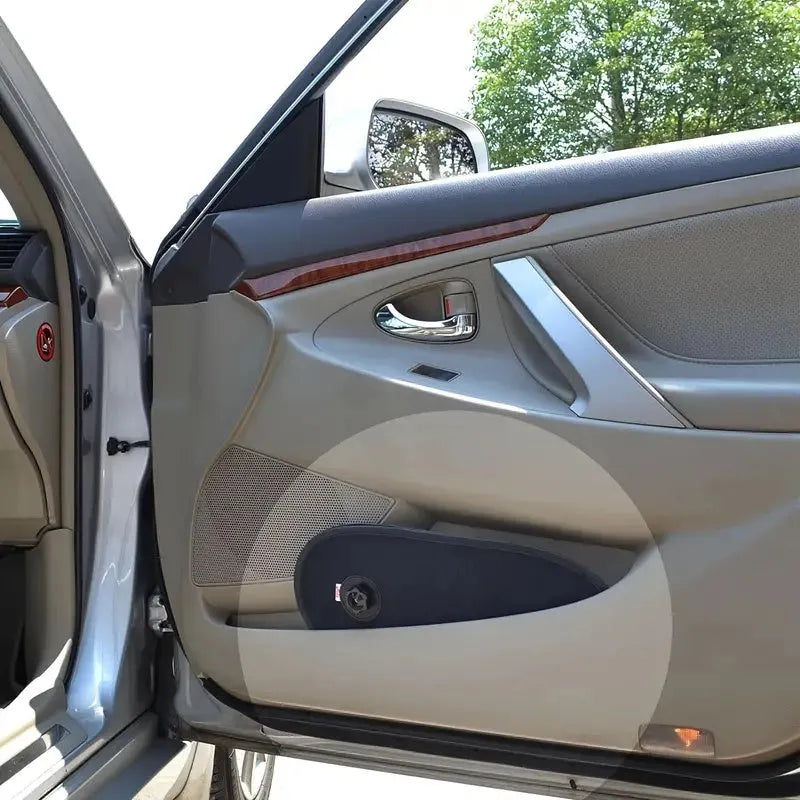 Black breathable car window shade with suction cups stretched across a car side window