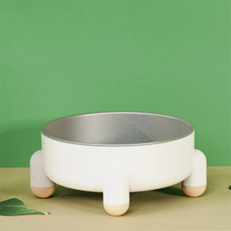 Green stainless steel pet bowl with non-slip base and raised feet for dogs and cats.