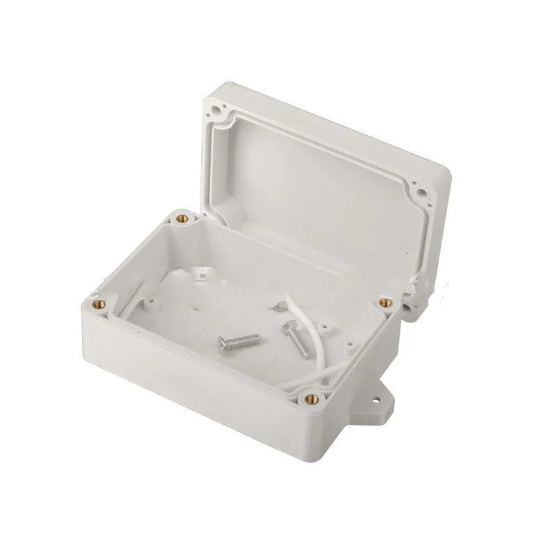 F4B-1 black ABS plastic waterproof junction box for electronic components, 100mm long.