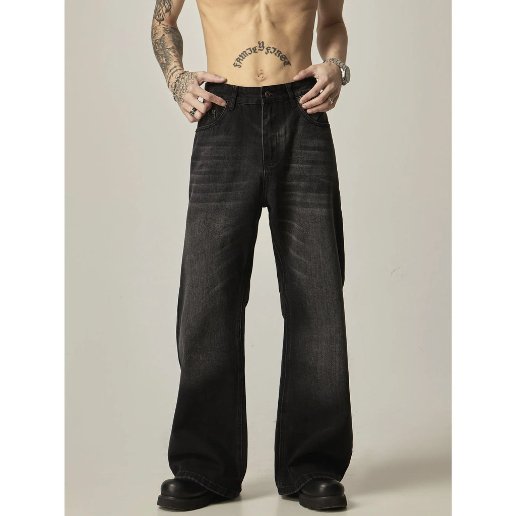 Black retro straight leg jeans with loose fit and zipper fly on hanger