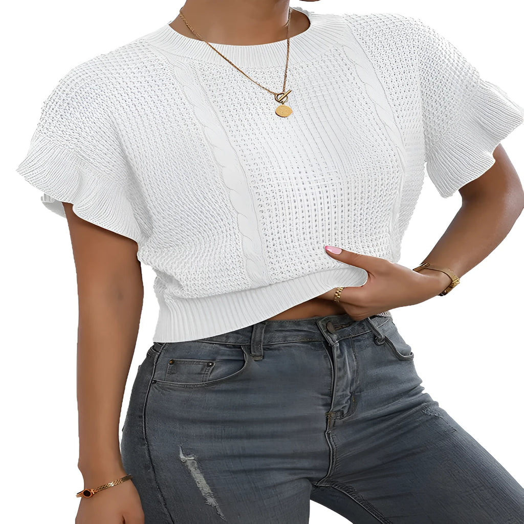 Knitted pullover sweater with ruffled short sleeves and a textured 3D pattern in a loose fit.