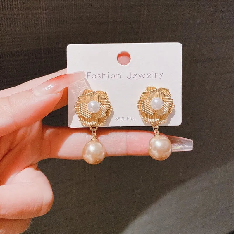 Gold colour stud earrings with ice flower pattern, rose pearl design, and central opal stone