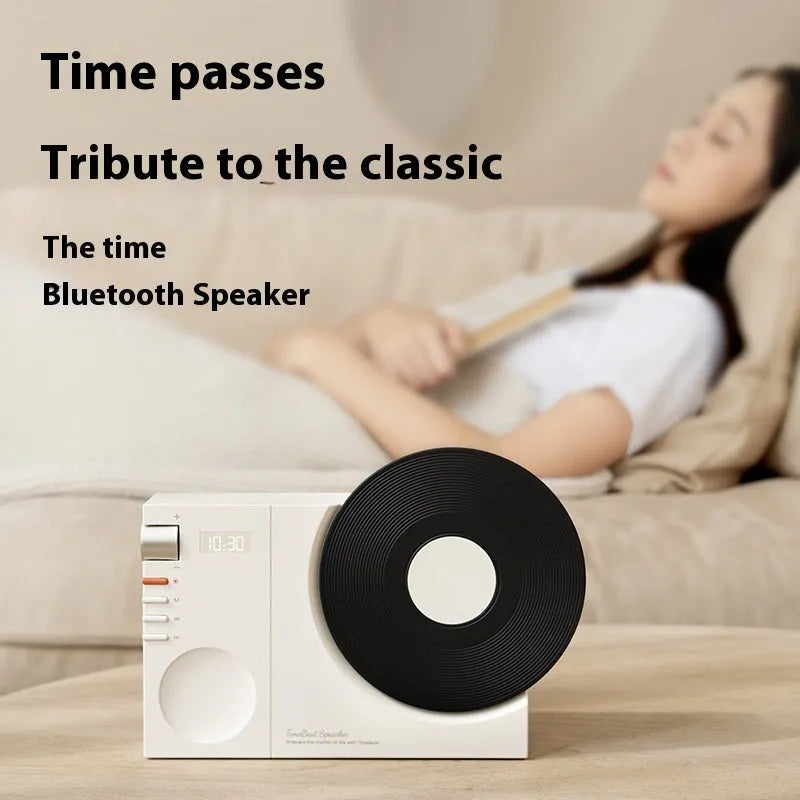 Mini Bluetooth portable speaker in coral pink colour showing USB charging port and card insertion slot