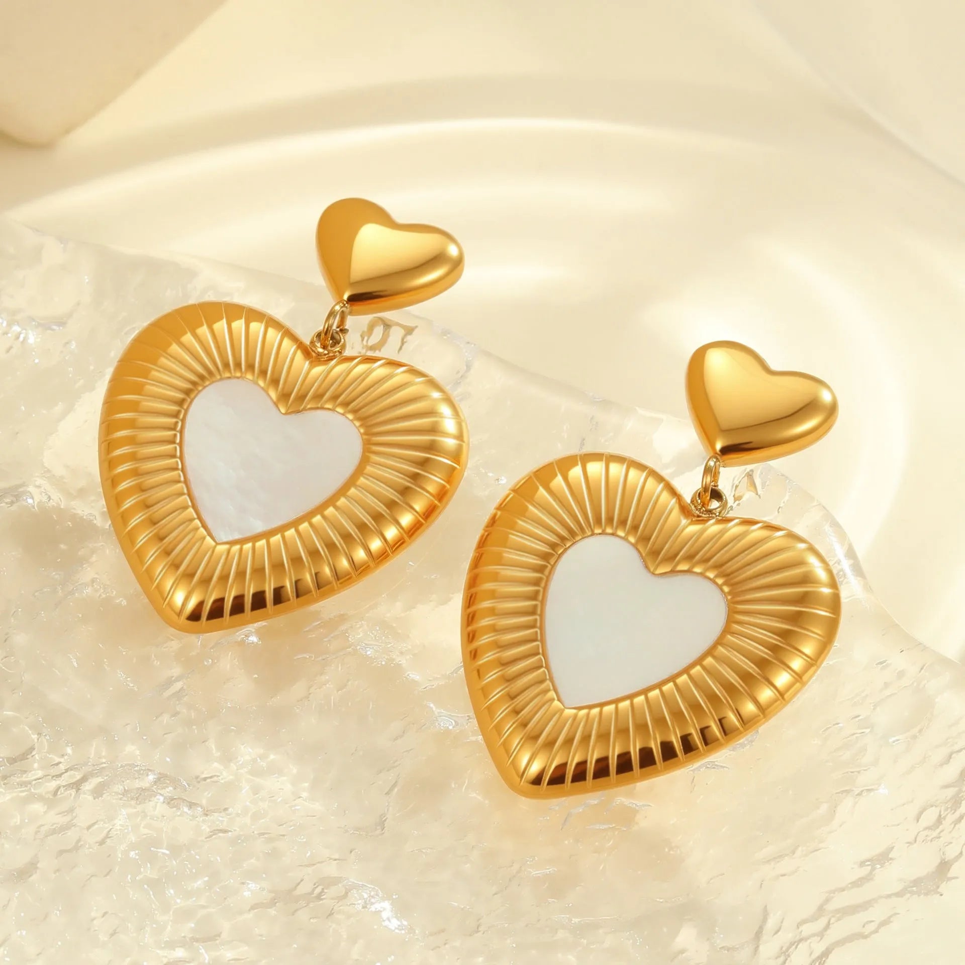 Heart-shaped stainless steel earrings with 18K gold electroplating in gold colour