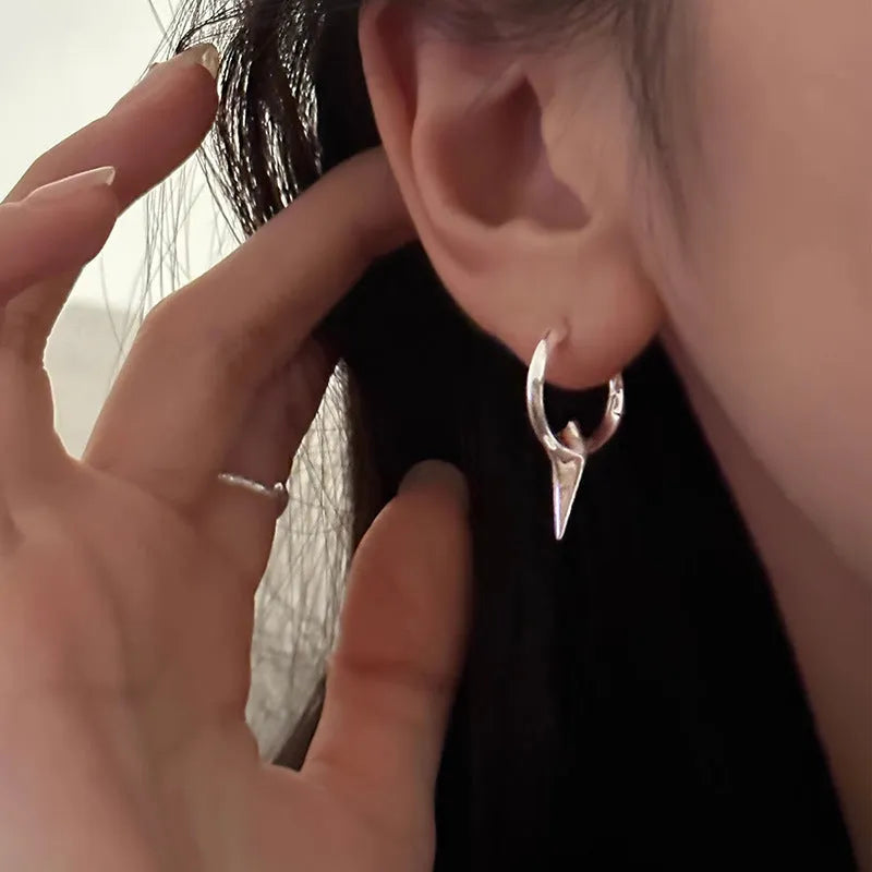 Geometric star-shaped women's ear clips in a platinum colour with a clip-on fastening.