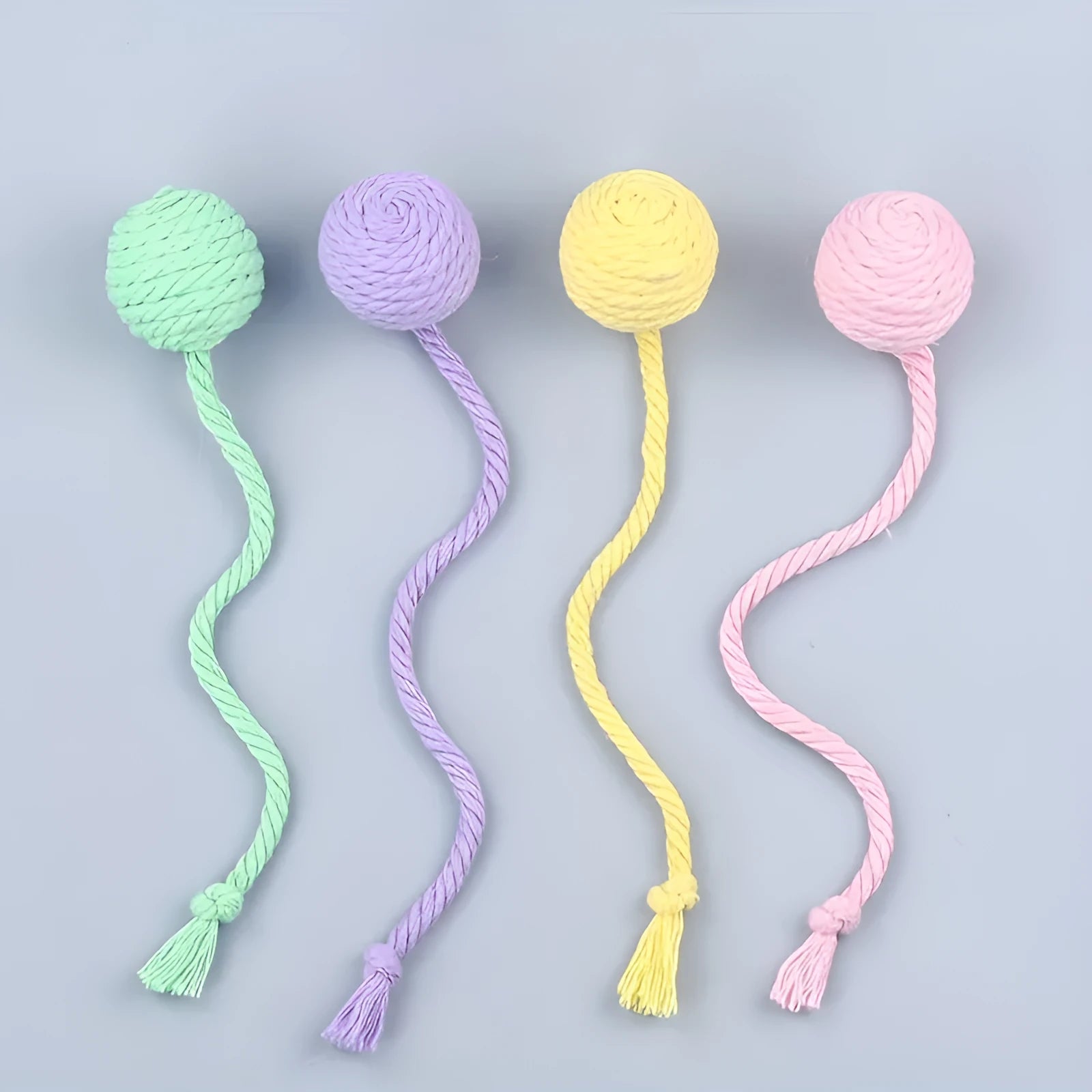 Colourful cat toy ball with rope handle and internal bell in small and medium sizes