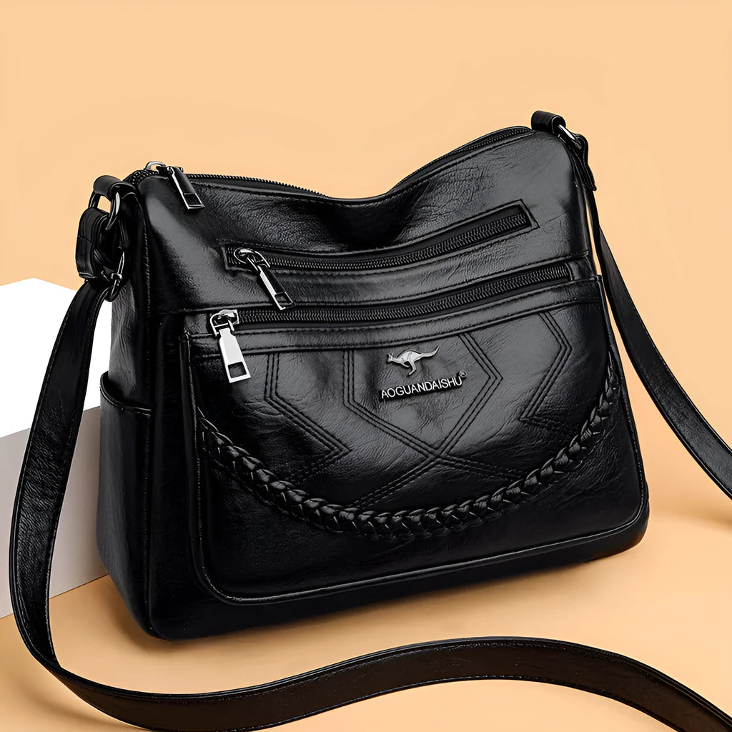 Soft PU leather women's shoulder bag with crossbody strap in black colour