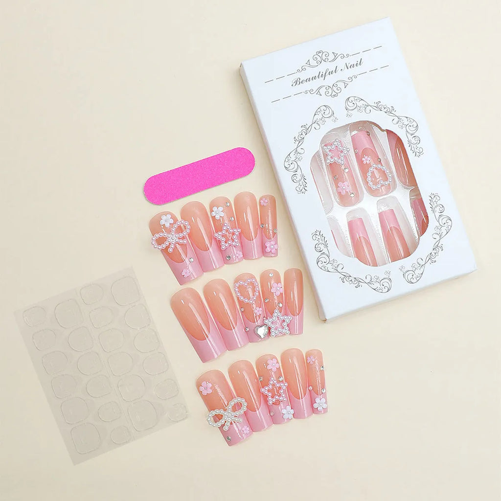 French style stick-on false nails with a love pattern and bow detail in colour XB-70-48 on a plastic armour suit.