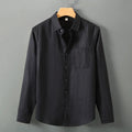 Long sleeve linen shirt in cardigan style with Chinese design elements, shown in light colour on hanger