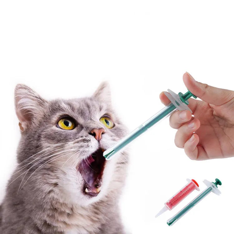 Two silicone pet pill shooters with soft tips, one larger and one smaller, for administering tablets to cats and dogs.