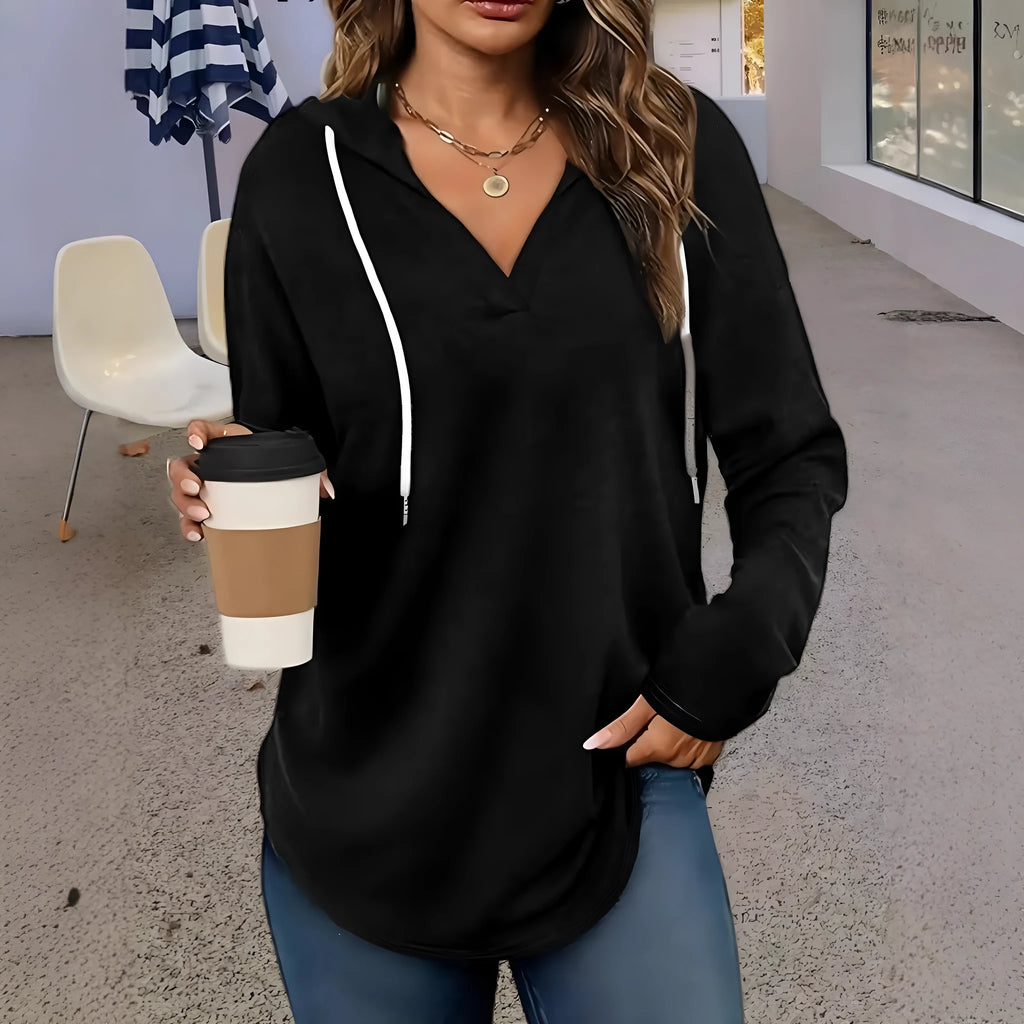 Red women's hooded V-neck sweatshirt with long sleeves on a hanger
