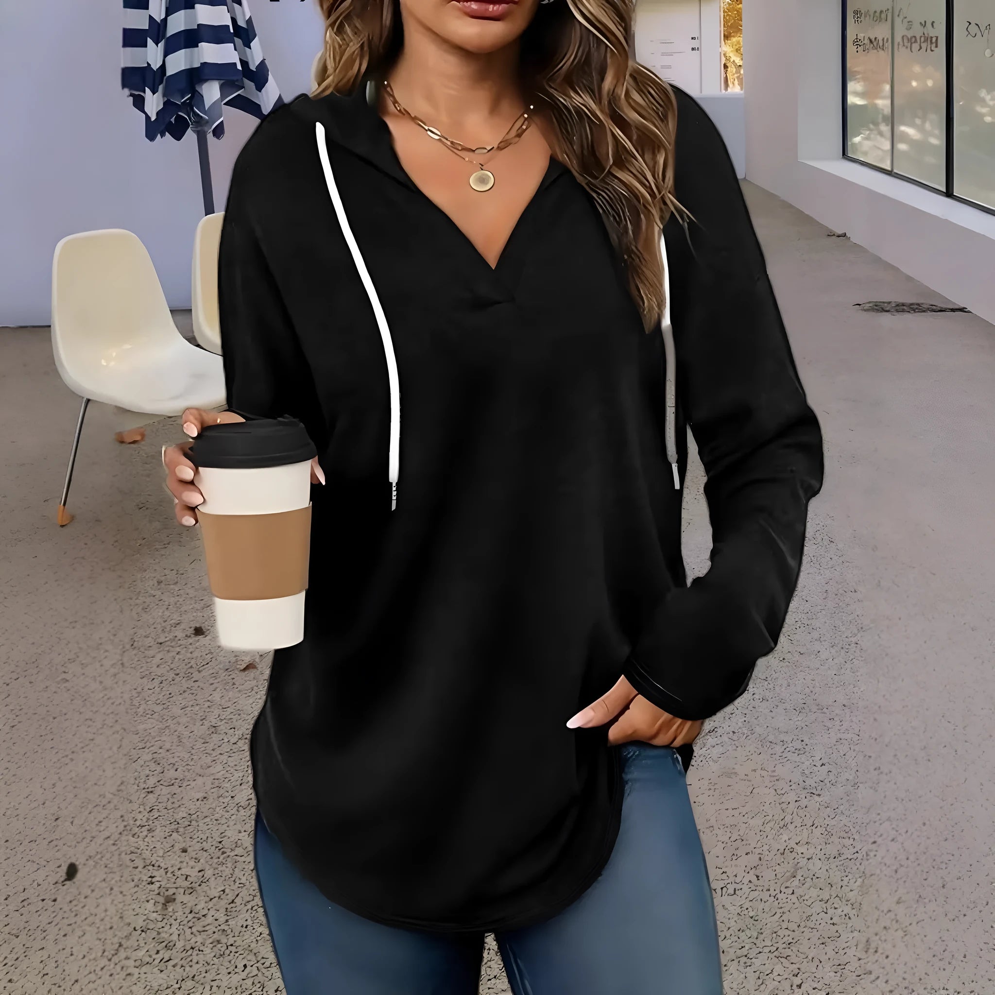 Red women's hooded V-neck sweatshirt with long sleeves on a hanger