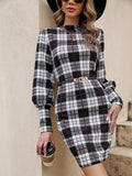 Black women's tight dress with lantern sleeves and leather stitching detail