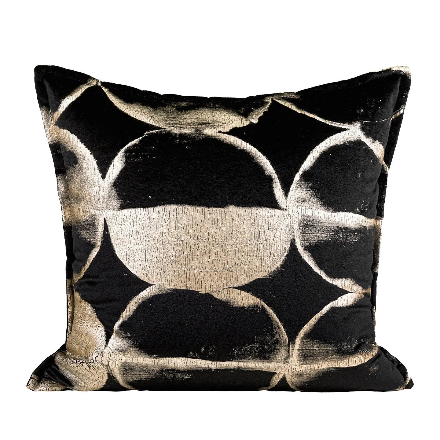 Black and gold abstract pattern flannel pillow cover on a grey sofa.
