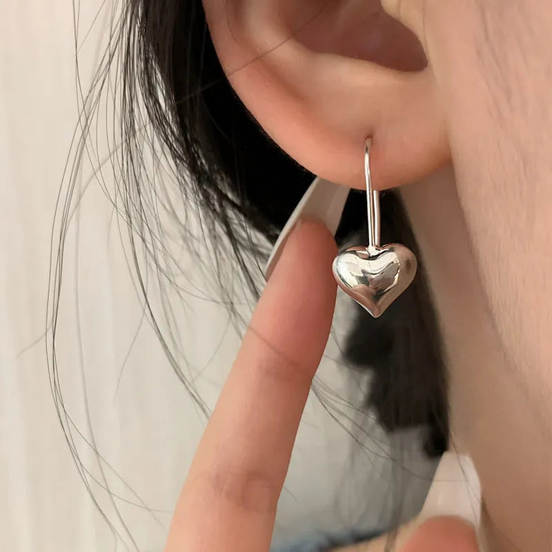 Korean-style copper heart earrings with 3D glossy finish and silver heart-shaped ear hooks