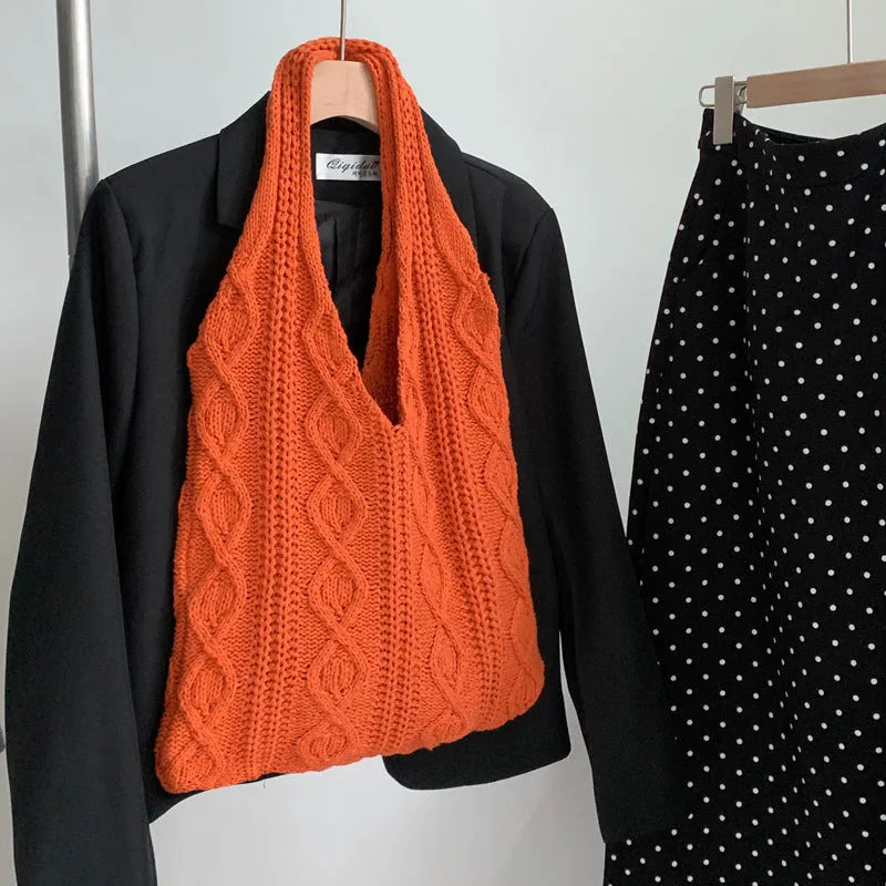 Retro hollow-knitted shoulder tote bag in solid colour with double straps showing textured yarn construction