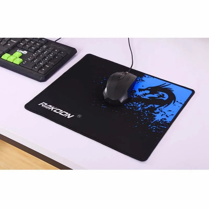 Mouse pad with textured surface and non-slip rubber base on a desk