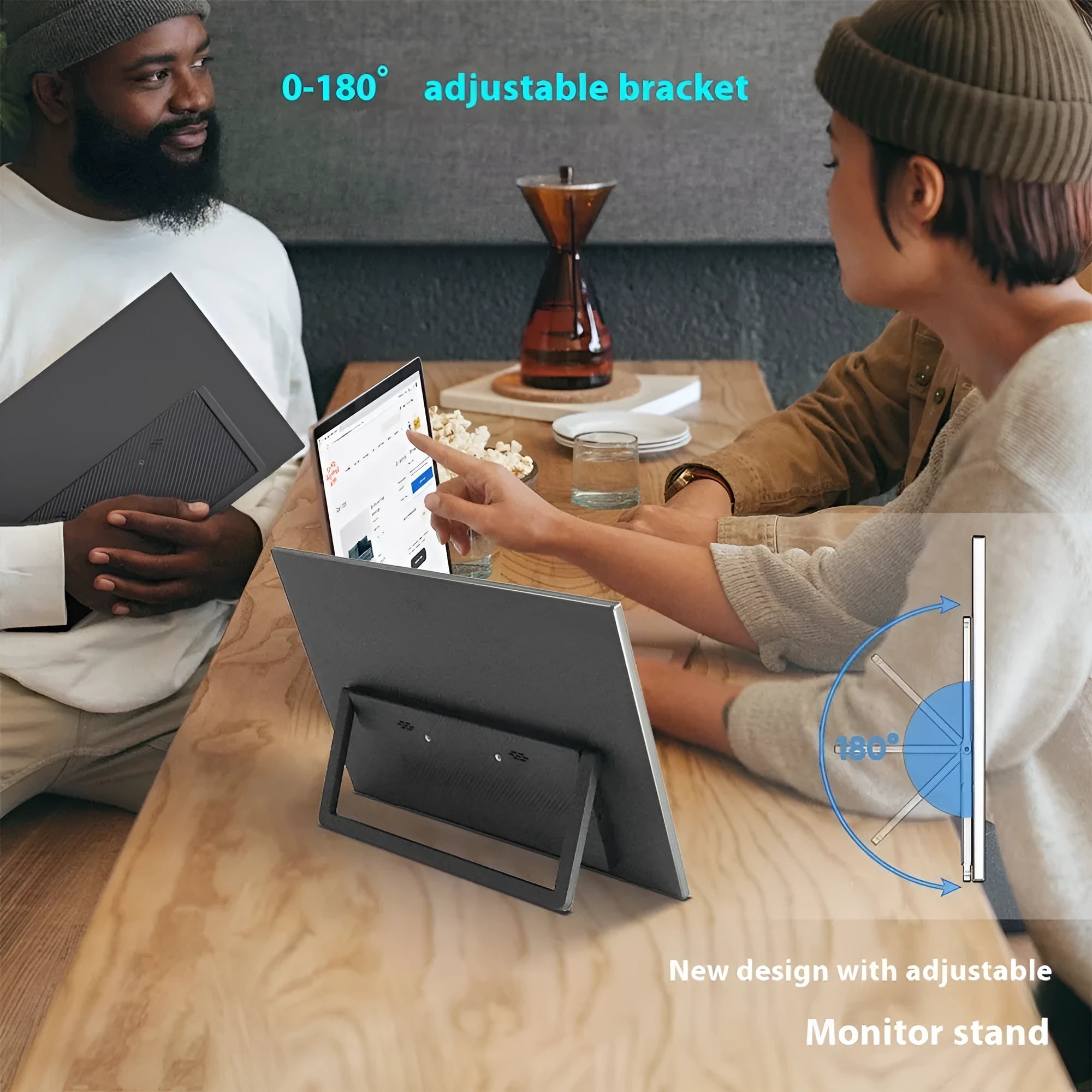 Black 15.6-inch portable LCD monitor with adjustable stand on a desk