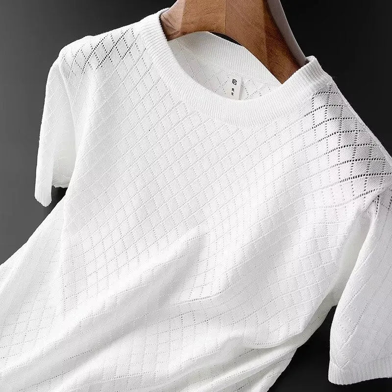 Man modelling a white ice silk V-neck t-shirt with a cut-out detail on the chest.